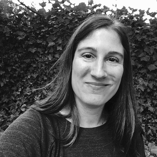 Black-and-white portrait of Lauren Wilson outdoors.